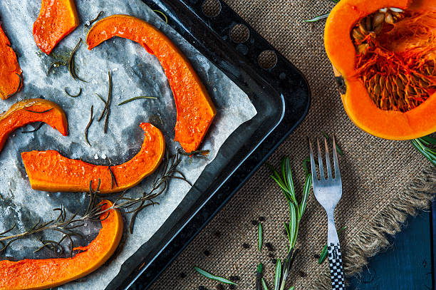 istock Slices of baked pumpkin on baking tray with fork 504631772