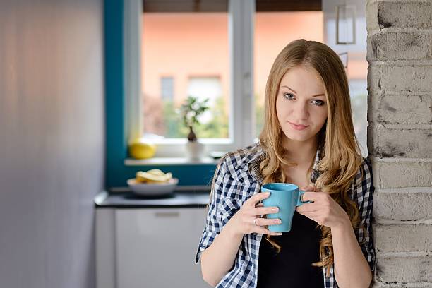 istock Beautiful blue-eyed blond woman drinking coffe 504632986