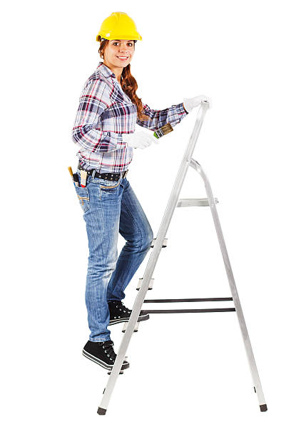 istock Young smiling worker stands on the building stairs 504633700