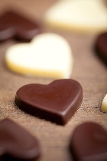 istock Chocolate hearts on old wooden table 504635454