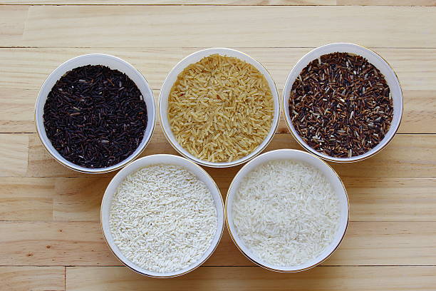 istock Rice on dark wooden table 504635906