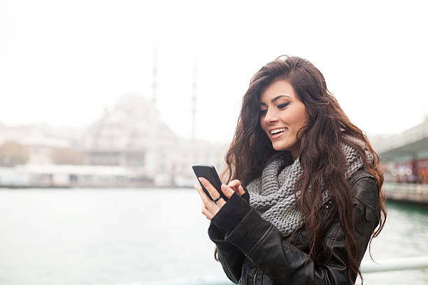 istock Turkish Girl Texting On Smartphone Outdoors In Istanbul 504635950