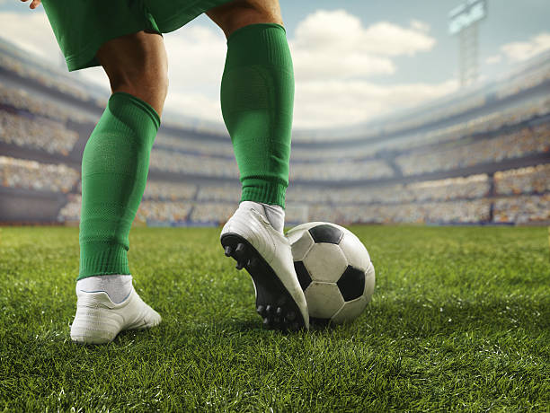 Close up soccer player with ball