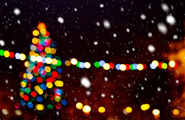 istock Christmas tree in the snowfall by night 504637264