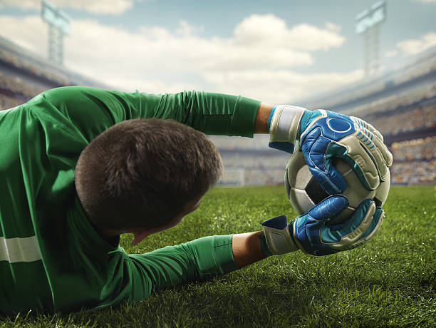 istock Soccer goalkeeper catches a ball 504637632