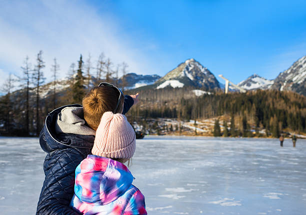 istock Father with daughter enjoying winter vacations 504639200