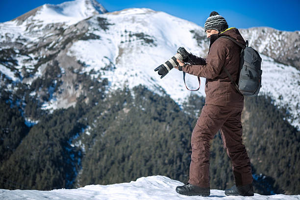 istock Photographer on  winter mountain 504639238