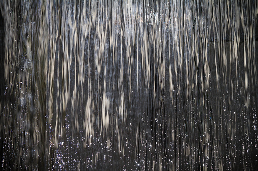 Water curtain sparkles in the sunlight.