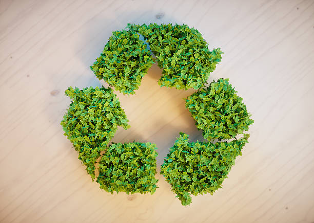 istock recycling symbol on wooden desk 504642452