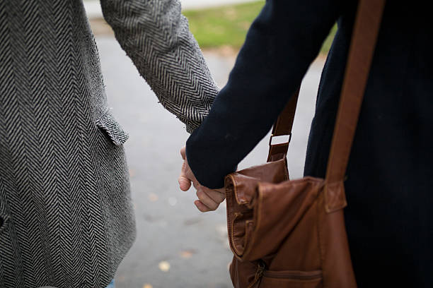 istock Cute couple in the park holding hands 504644276
