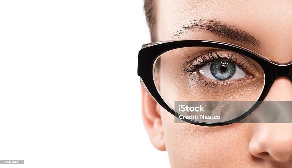 Eyewear Cloese up of young woman wearing eyeglasses isolated on white background with cop space Eyeglasses Stock Photo
