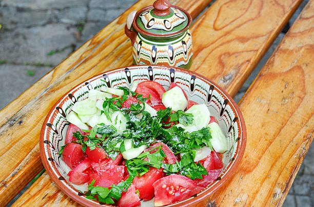 Tomato salad in traditional bulgarian plate.Shopska salad