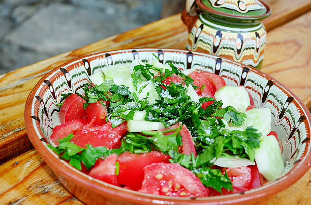 Tomato salad in traditional bulgarian plate.Shopska salad