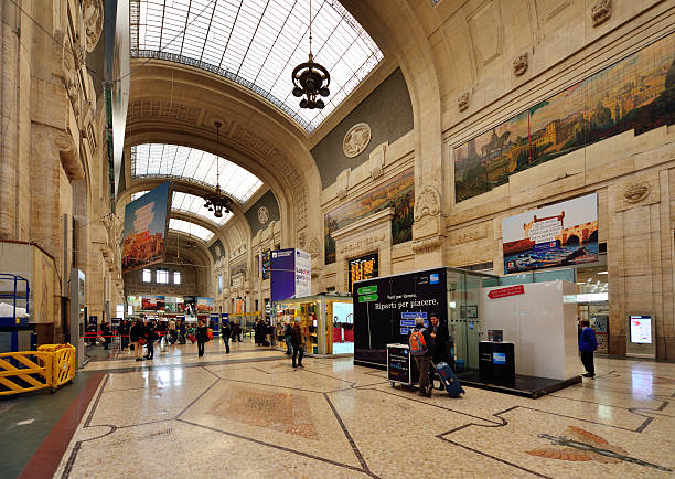 The busy and famous main hall in the central station of milan, italy