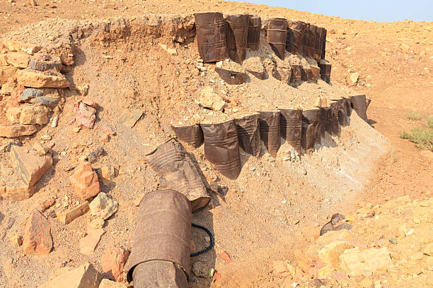 istock Rusty oil drums in the desert 504647112