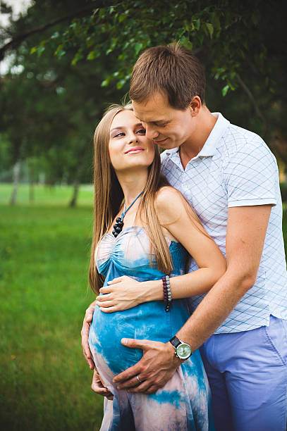 istock Pregnant Couple on the park 504647294