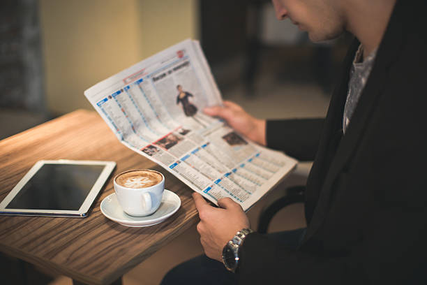 istock young businessman reading a newspaper 504647320