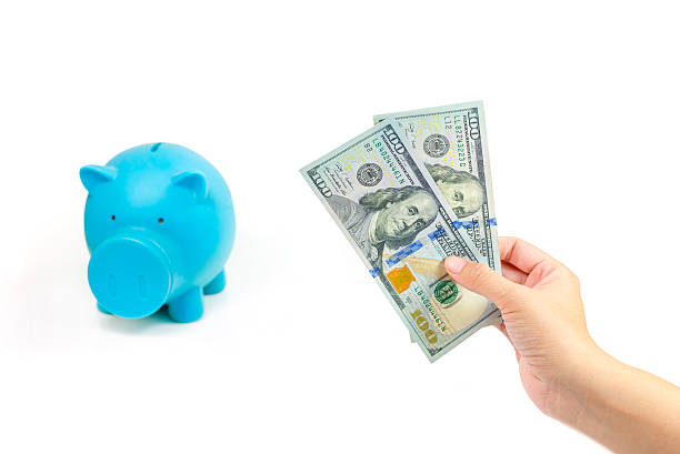istock Hand with usd money,  Save Money 504648964