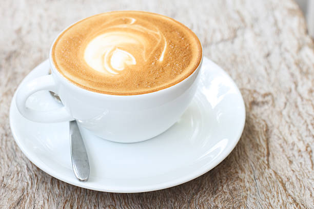 istock latte art  on wood background 504652659