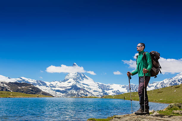 istock hiker enjoy summer day near the Matterhorn mountain 504653765