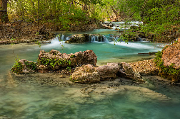 Havasu Canyon Waterfall Creek Havasu Canyon Waterfall Creek.  Havasu Canyon Travertine Waterfall Scenic Landscape on Havasupai Indian Reservation Arizona USA.  Captured as a 14-bit Raw file. Edited in ProPhoto RGB color space. harasu canyon stock pictures, royalty-free photos & images