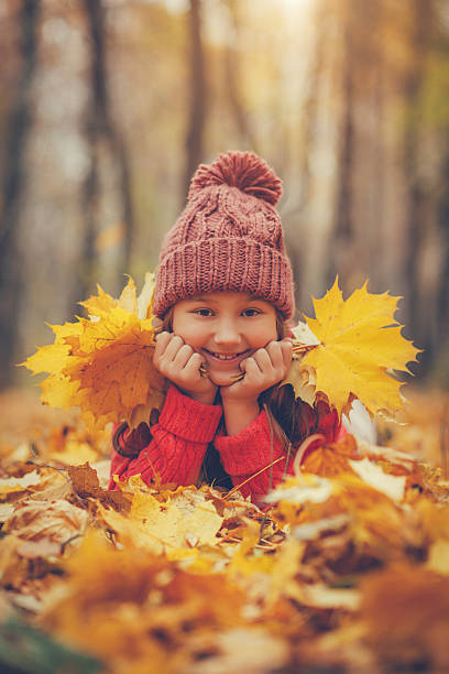 istock Child in autumn 504655277