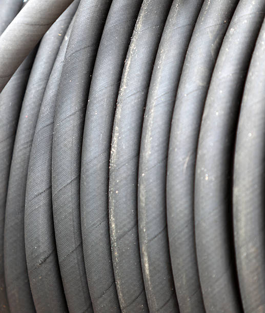 istock rolled up of gray rubber hose 504657317
