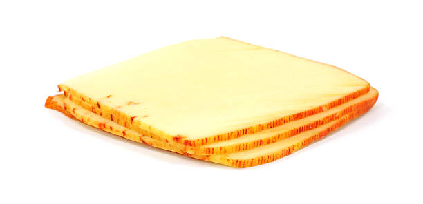 Muenster cheese Four slices of muenster cheese on a white background. munster stock pictures, royalty-free photos & images