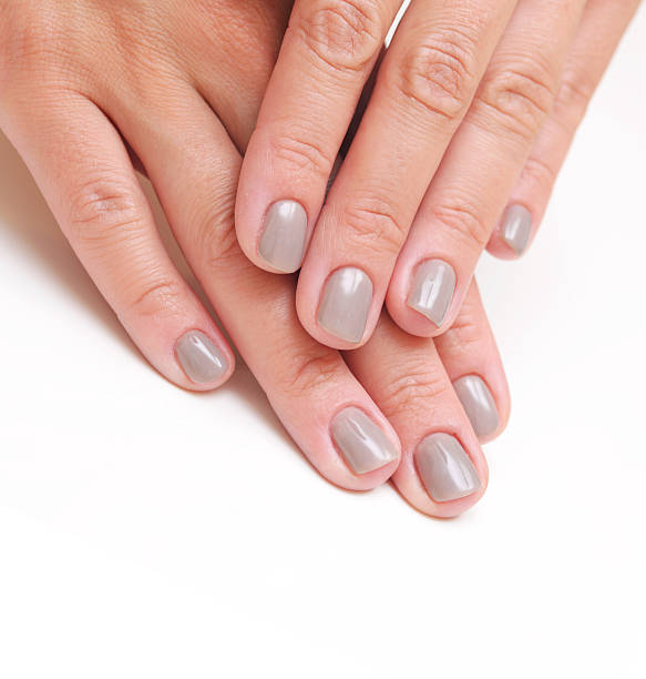 istock hands with woman's professional nails manicure 504683387
