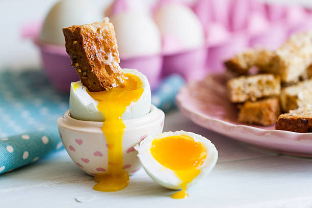 istock Opened boiled blue duck egg with soft yolk with toast 504683945