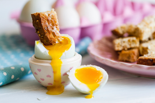 Series on boiled duck egg for breakfast, with toast soldiers