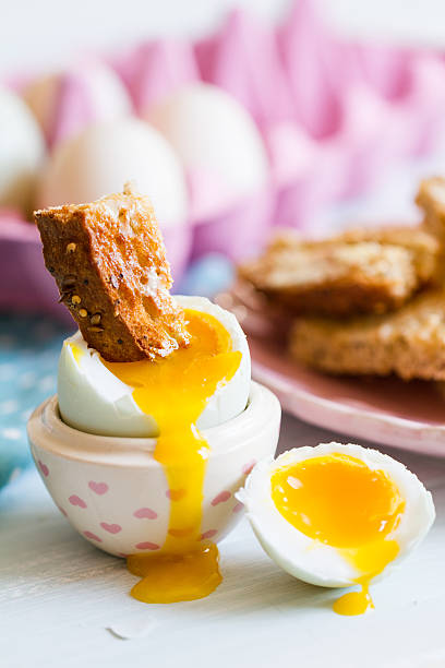 istock Opened boiled blue duck egg with soft yolk with toast 504683949