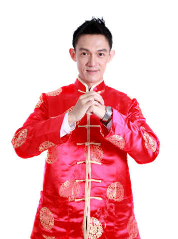 Happy Chinese new year.Young Asian man with gesture of congratulation