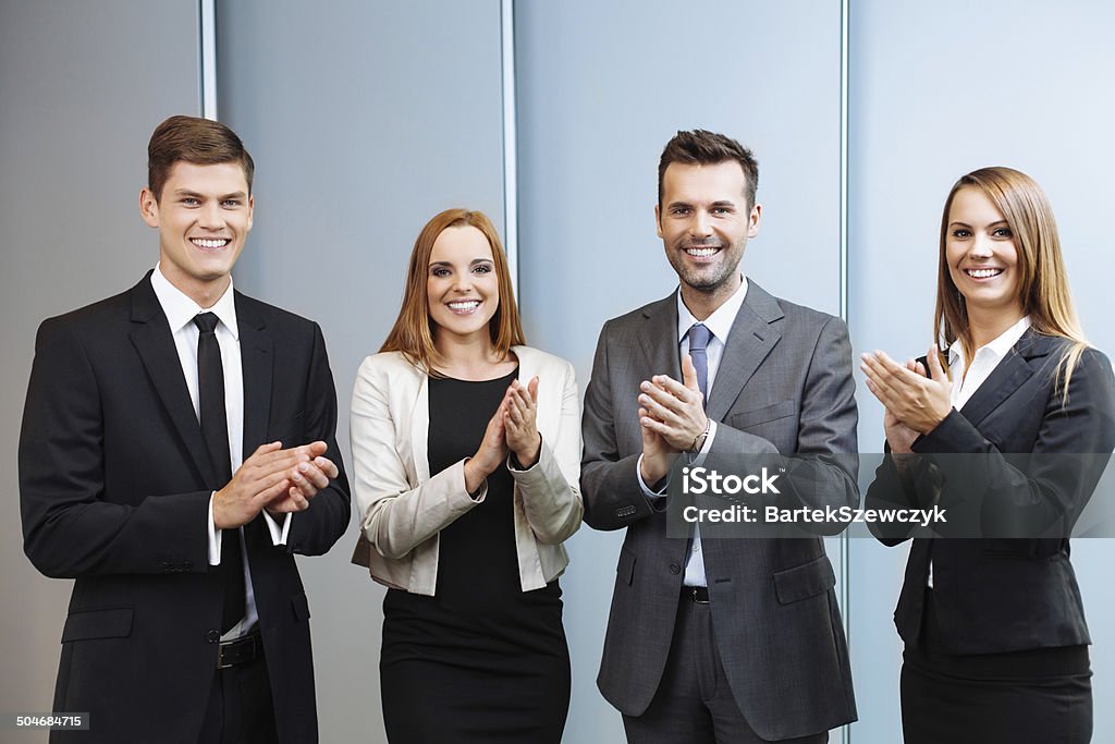 Group of happy business people clapping their hands Group of successful business people clapping their hands Achievement Stock Photo