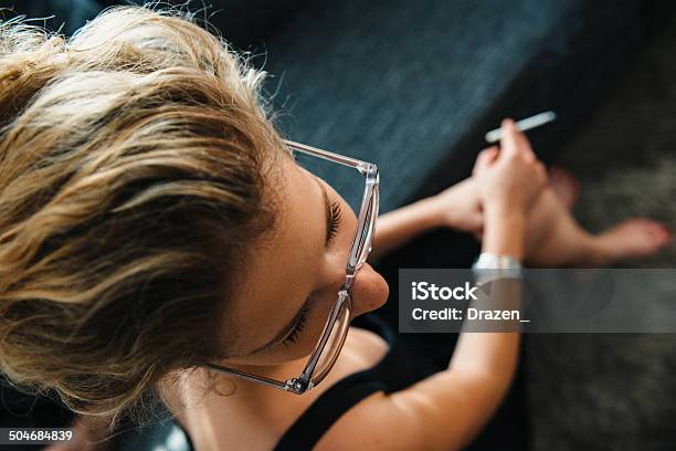 Portrait Of Brunette With Glasses And Cigarette From Above Stock Photo - Download Image Now