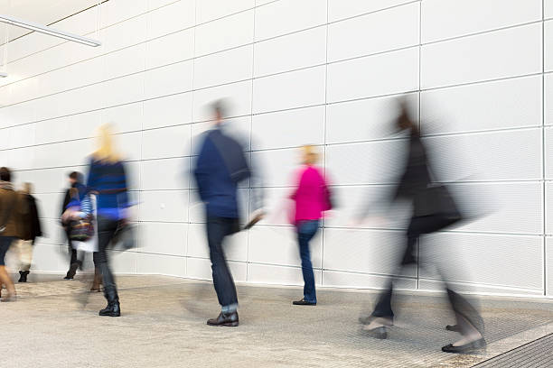 istock Group of Motion Blurred Commuters Rushing in Corridor 504685221