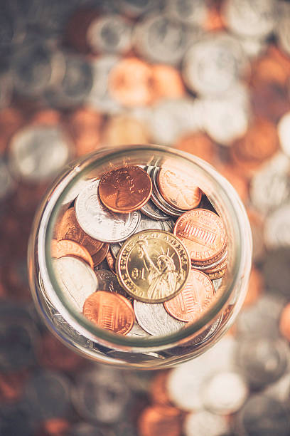 istock Cash Jar Filled with Cash Donations 504686039