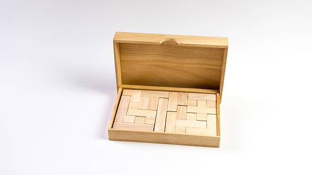 istock Wooden puzzle box. Isolated on white background 504693894