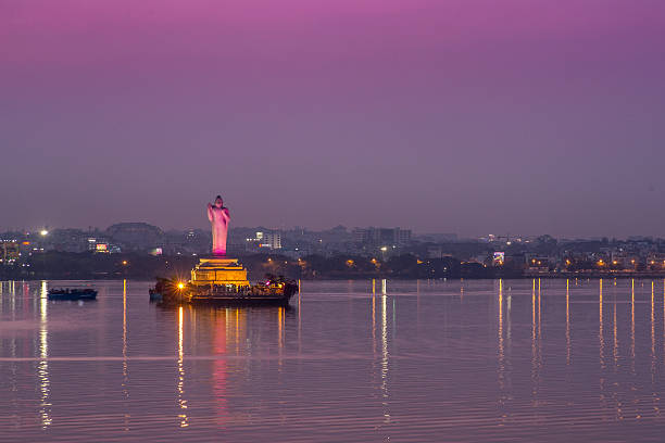 Hyderabad_buddha Evening picture of the monolithic statue of Gautam Buddha stands in the middle of the lake Hussain Sagar in Hyderabad, India. hyderabad india photos stock pictures, royalty-free photos & images