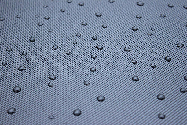 istock Image of grey mesh patio-table in garden, small water droplets 504696598