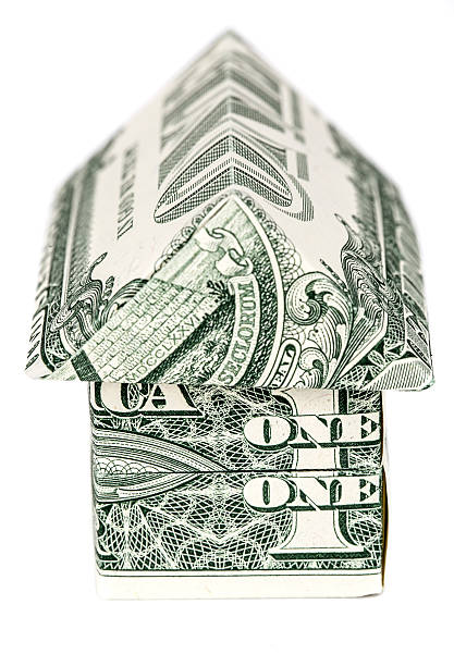 istock Dollar origami house 504697194