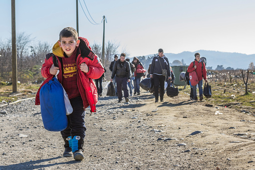 Gevgelija, Macedonia - December 23, 2015: Refugees arriving at the refugee camp of Vinojug in Gevgelija (Macedonia) after having crossed the border with Greece at Eidomeni.