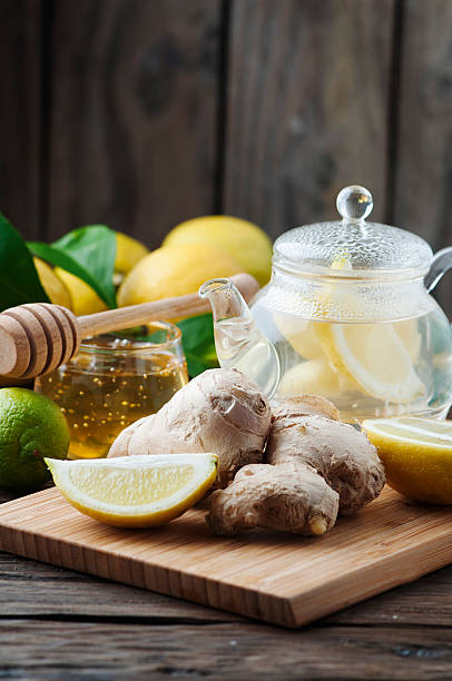 istock Cocktail with ginger, lemon and honey on the wooden table 504697818