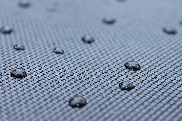 istock Image of water droplets on mesh surface outside in garden 504697820