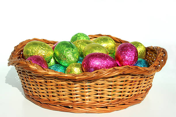 Bright pink tin bucket filled with colorful Easter Eggs.
