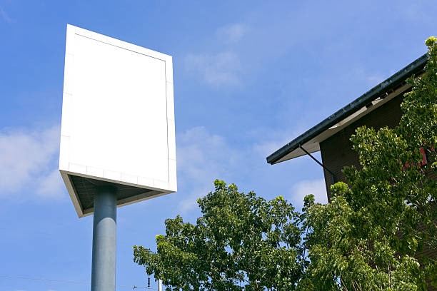 istock Post sign blank outdoor on the sky and tree. 504702328