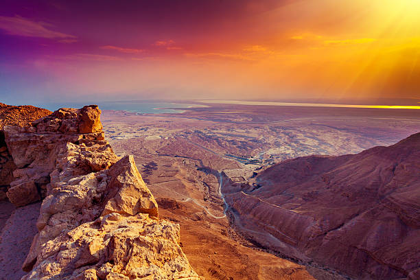 beautiful sunrise over masada fortress - israël stockfoto's en -beelden