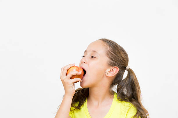 istock Happy Girl Holding Apple 504703866
