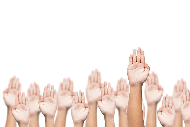 istock business crowd raising hands, many hands raise high up 504703906