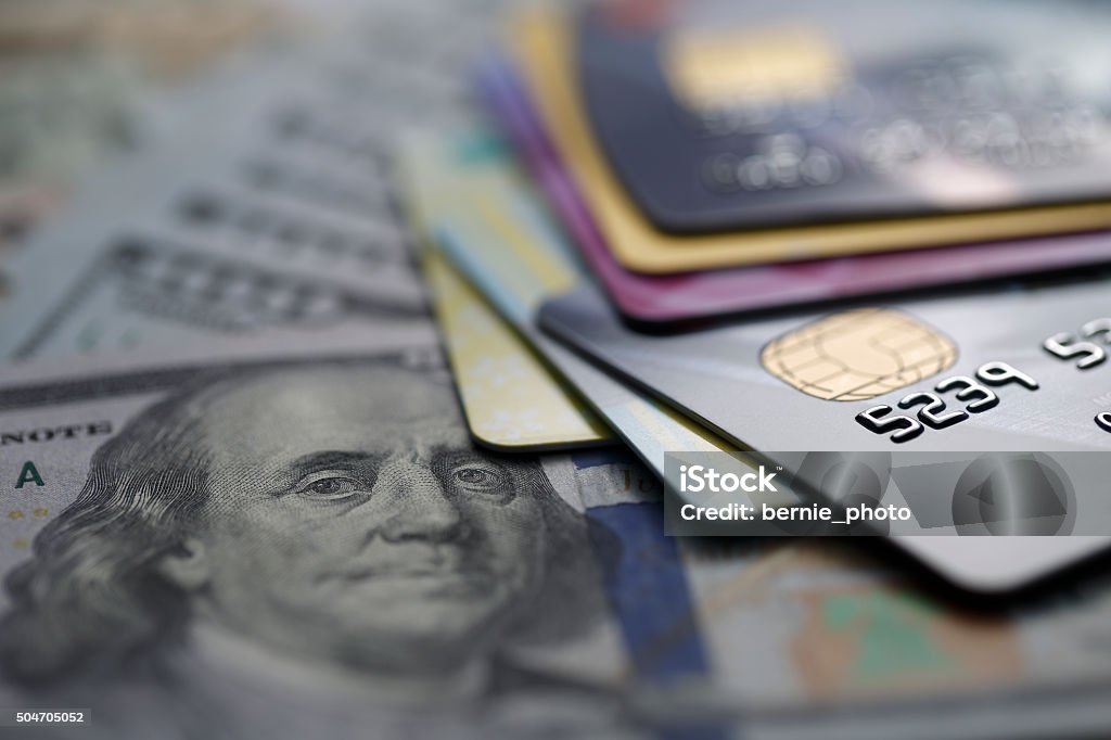 credit cards on dollars Close up picture of credit card putted on dollars ; shot with very shallow depth of field Credit Card Stock Photo
